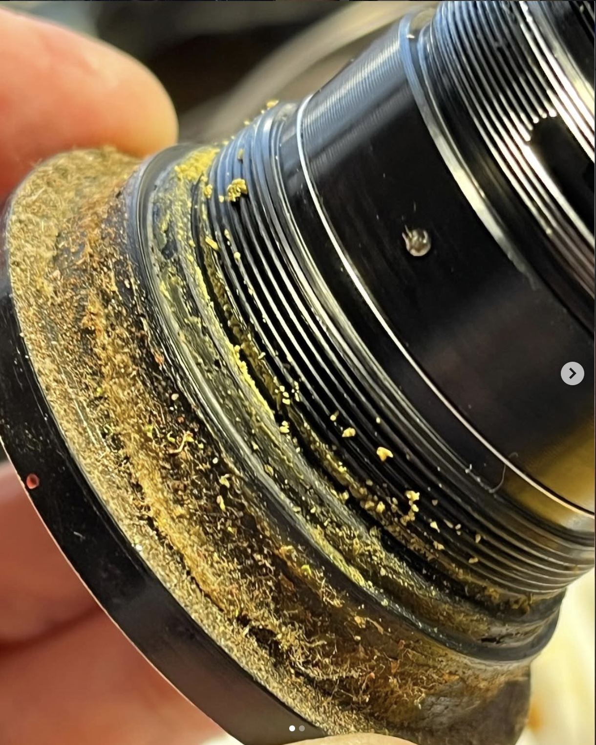 Old dried lubricant inside a Helios 44-2 lens